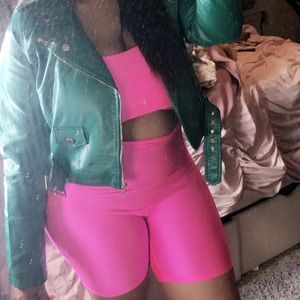 Neon Pink long sleeve spandex romper w/ cut out.